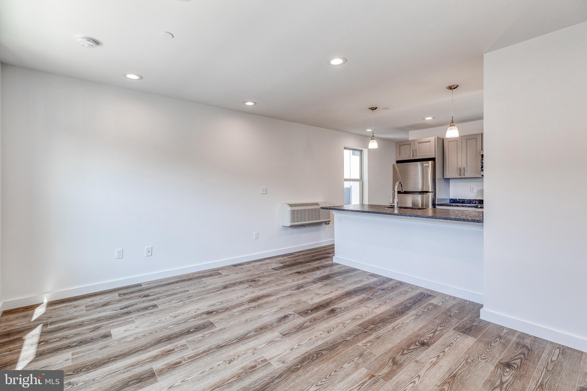 751 North 43rd Street, Unit 302 Philadelphia, PA 19104 - Photo 8 of 17 a view of kitchen and kitchen with a refrigerator