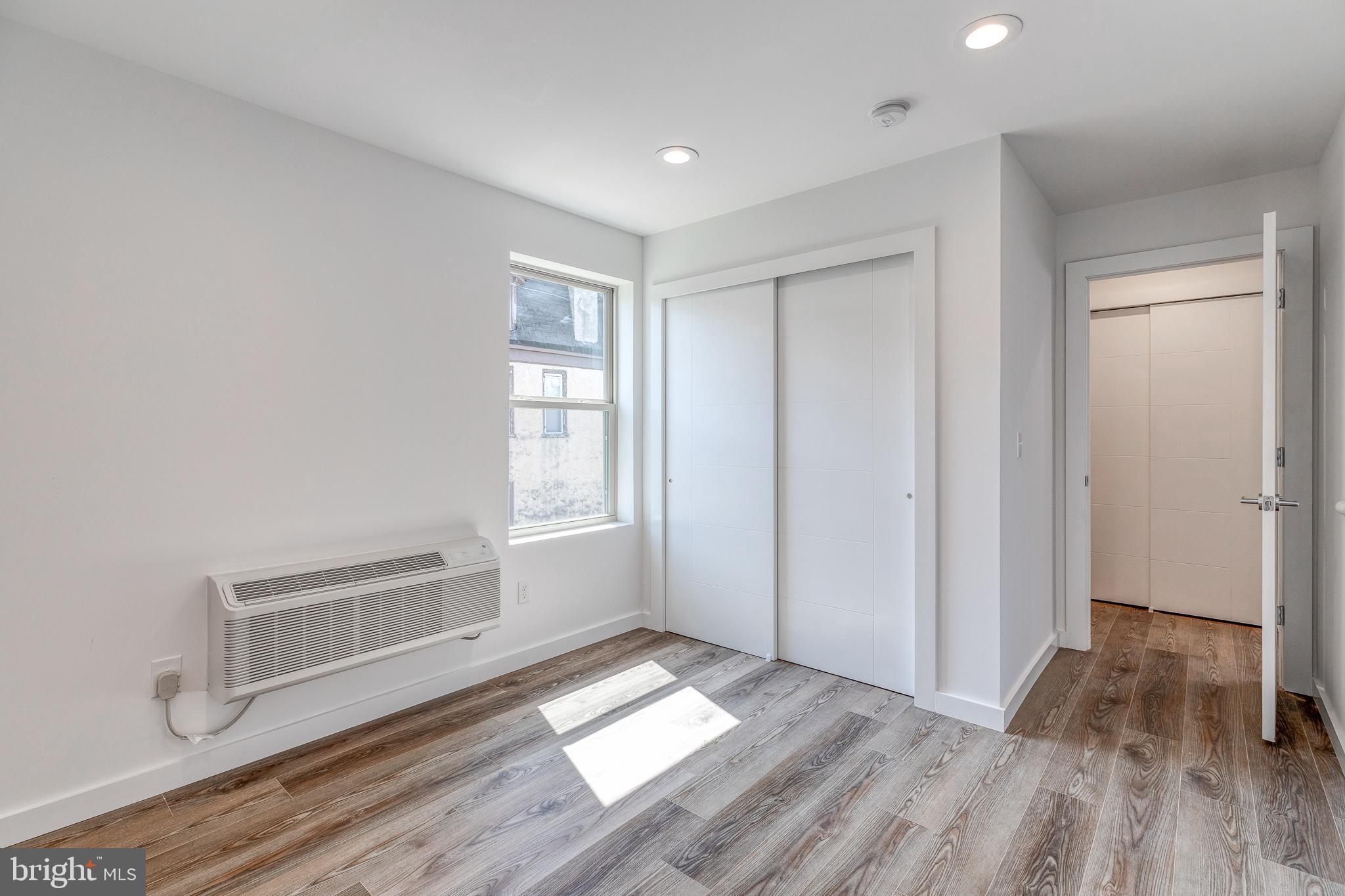 751 North 43rd Street, Unit 302 Philadelphia, PA 19104 - Photo 9 of 17 wooden floor in an empty room with a window