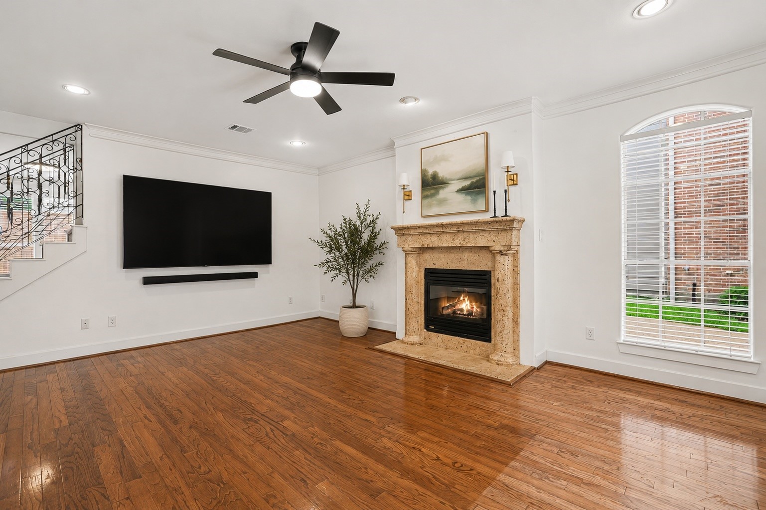 1470 Springrock Lane, Unit 6 Houston, TX 77055 - Photo 7 of 31 This spacious living area features hardwood floors, a cozy fireplace, high ceilings, crown molding, and large windows that fill the room with natural light. Virtually staged.