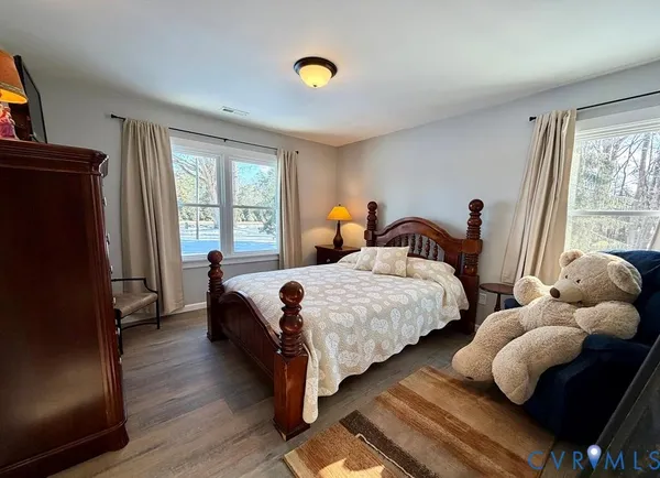 a bedroom with bed and a window