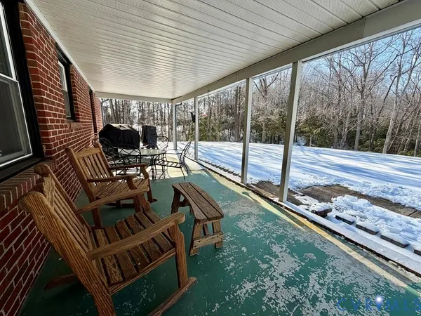 a view of a chairs and table in the patio