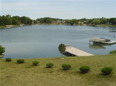5050 # D Spinnaker Crown Point Crown Point, IN 46307 - Photo 2 of 10 a view of a lake with houses in the back