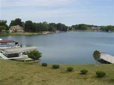 5050 # D Spinnaker Crown Point Crown Point, IN 46307 - Photo 5 of 10 a view of a lake with houses in the back