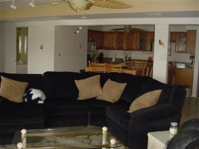 5050 # D Spinnaker Crown Point Crown Point, IN 46307 - Photo 6 of 10 a living room with furniture and a wooden floor