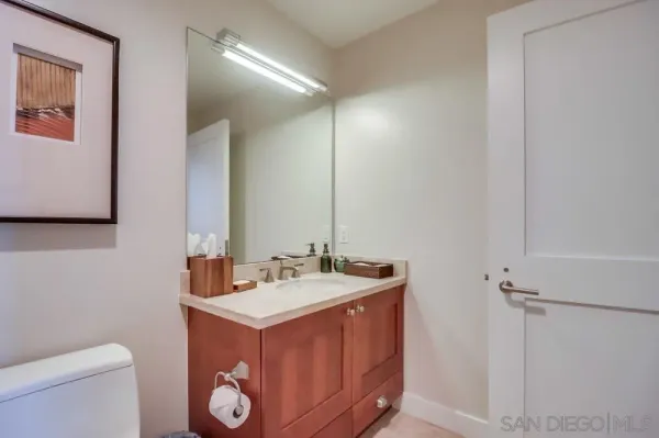 a view of walk in closet with clothes