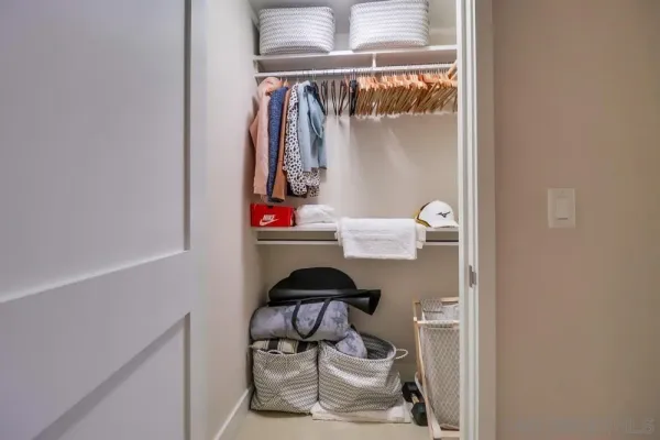 a view of a hallway with washer and dryer