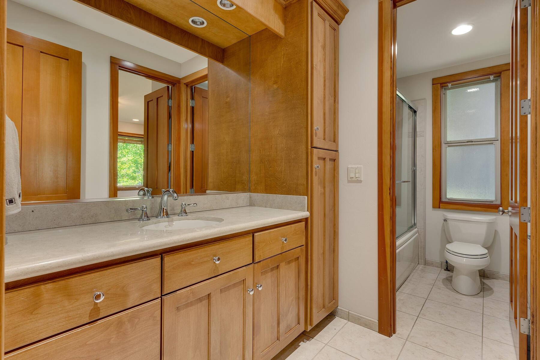 11939 Dove Terrace Truckee, CA 96161 - Photo 22 of 28 a bathroom with a granite countertop sink toilet and shower