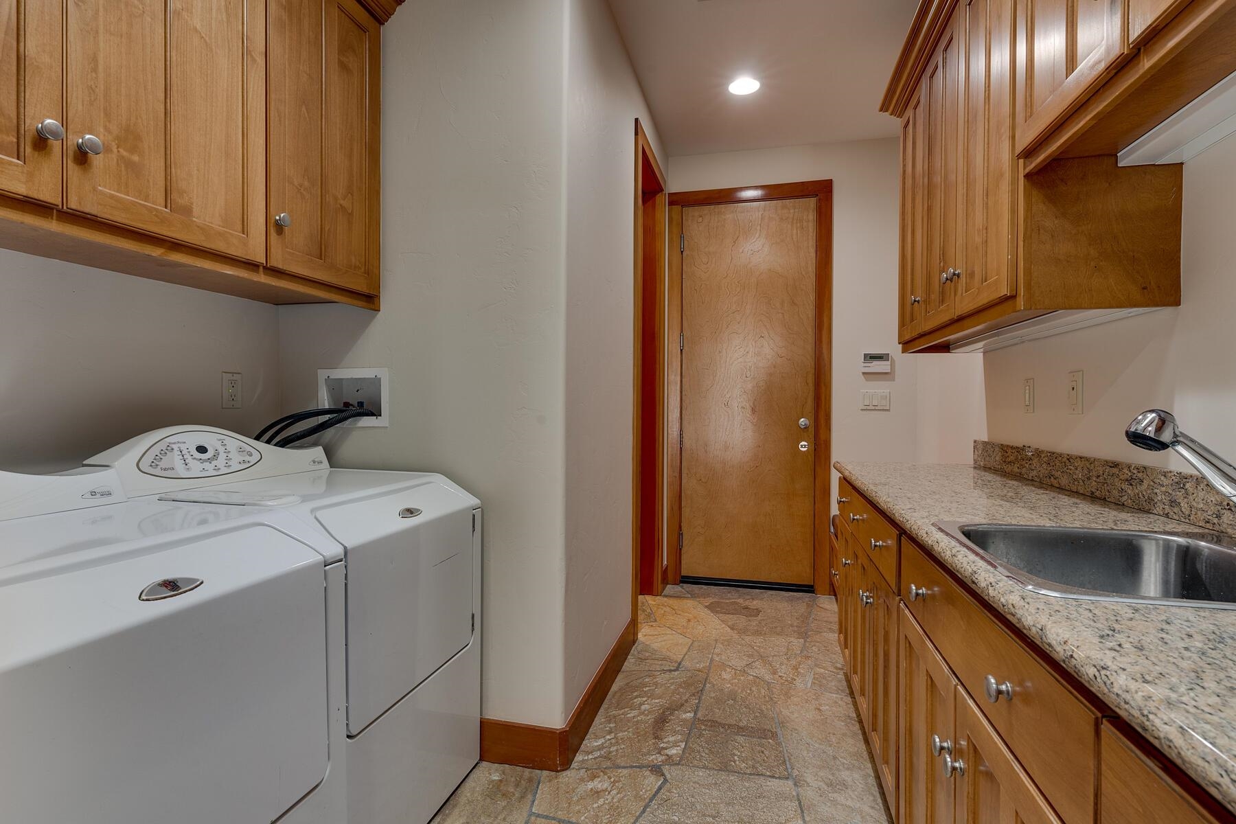 11939 Dove Terrace Truckee, CA 96161 - Photo 23 of 28 a utility room with sink dryer and washer