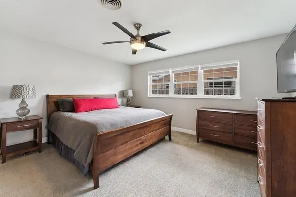 a bed room with a bed and a window