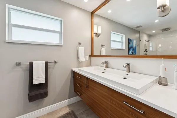 a bathroom with a sink and a mirror