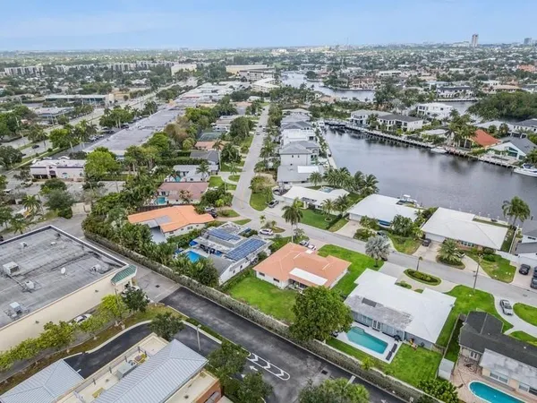an aerial view of residential houses with outdoor space