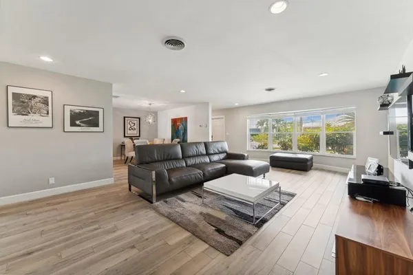 a living room with furniture and a large window