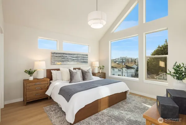 a bedroom with a large bed and a window