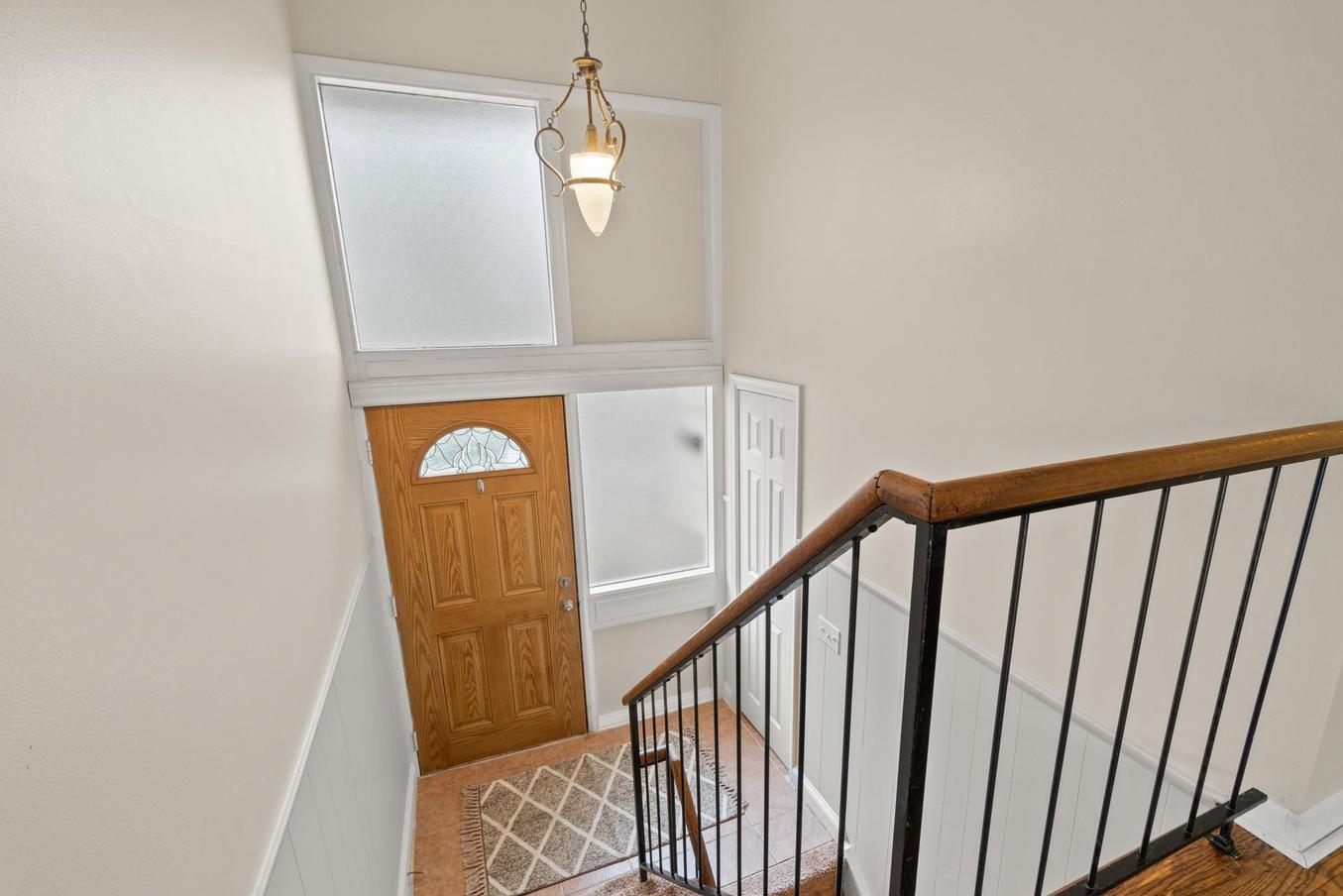 6505 Farley Street Springfield, VA 22152 - Photo 2 of 30 a view of a hallway with wooden floor and staircase