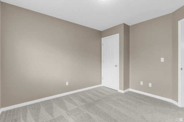 656 South 910 West, Unit 25 Pleasant Grove, UT 84062 - Photo 18 of 25 Neutral-toned walls complement the light gray patterned carpeting.
