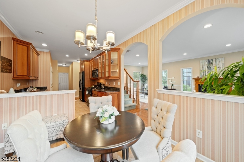 26 Chestnut Court Cedar Grove, NJ 07009 - Photo 11 of 43 a view of a dining room with furniture and wooden floor