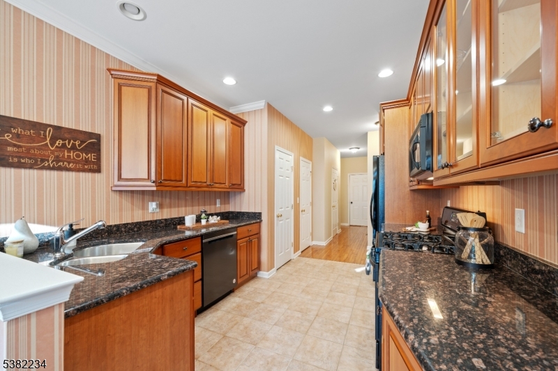 26 Chestnut Court Cedar Grove, NJ 07009 - Photo 14 of 43 a kitchen with stainless steel appliances granite countertop a sink stove and cabinets