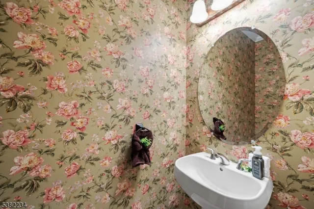 a bathroom with a sink and mirror