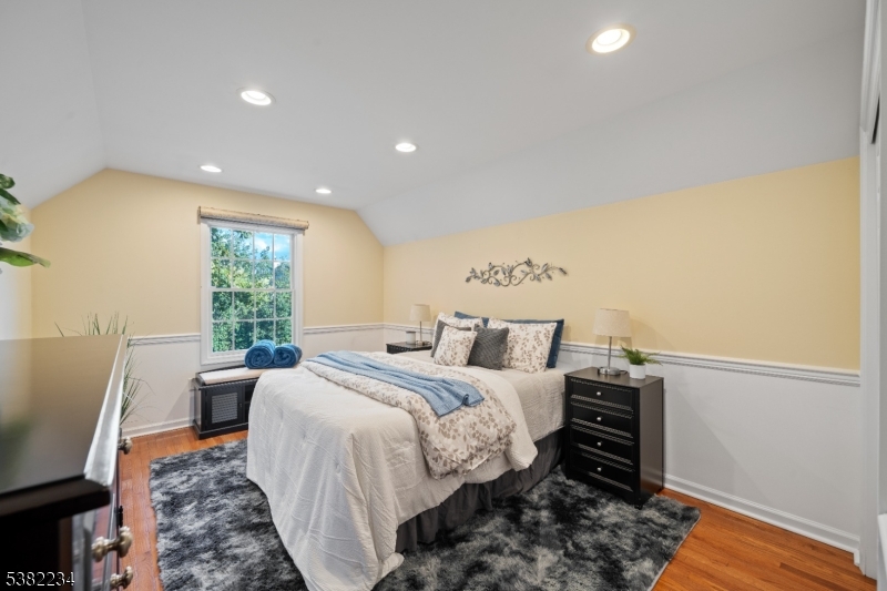 26 Chestnut Court Cedar Grove, NJ 07009 - Photo 29 of 43 a bed room with a bed and a chair