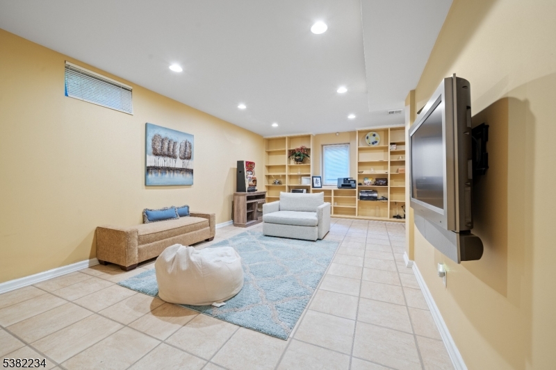 26 Chestnut Court Cedar Grove, NJ 07009 - Photo 36 of 43 a living room with couches and kitchen view