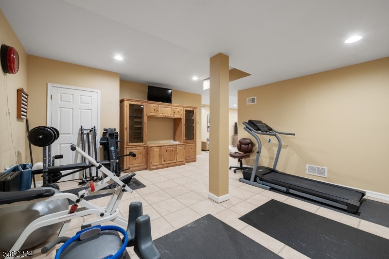 26 Chestnut Court Cedar Grove, NJ 07009 - Photo 38 of 43 a view of a room with gym equipment