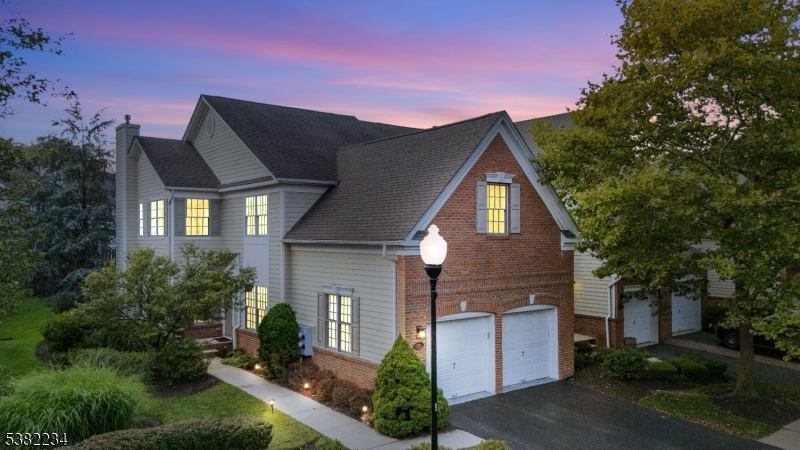 26 Chestnut Court Cedar Grove, NJ 07009 - Photo 41 of 43 a front view of a house with a yard and garage