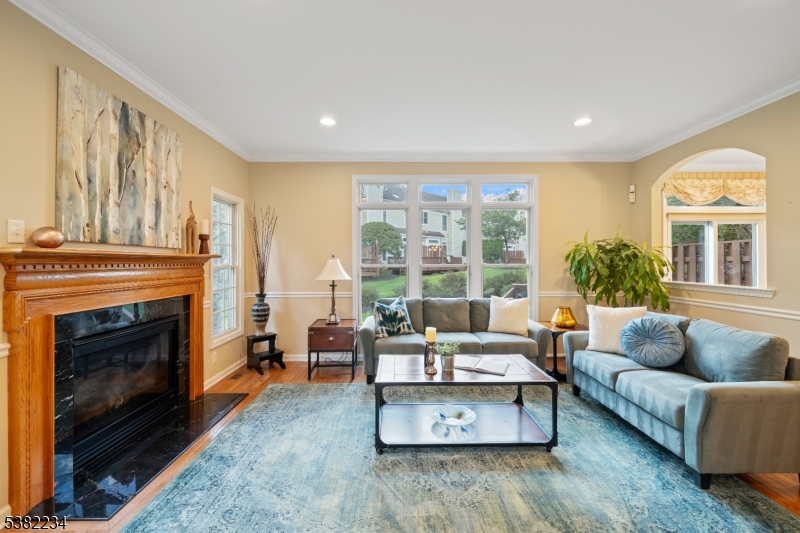 26 Chestnut Court Cedar Grove, NJ 07009 - Photo 6 of 43 a living room with furniture and a fireplace