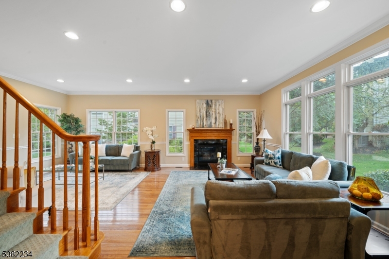 26 Chestnut Court Cedar Grove, NJ 07009 - Photo 8 of 43 a living room with furniture and a fireplace