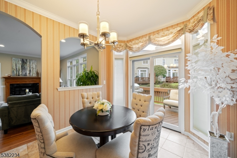 26 Chestnut Court Cedar Grove, NJ 07009 - Photo 9 of 43 a view of a dining room with furniture window and outside view