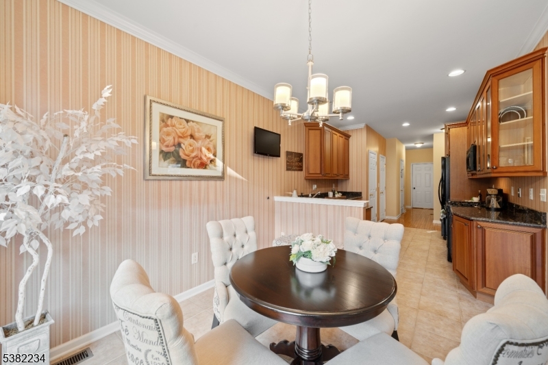 26 Chestnut Court Cedar Grove, NJ 07009 - Photo 10 of 43 a living room with furniture kitchen and a chandelier