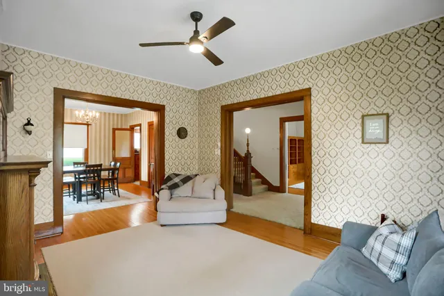 a view of a dining room with furniture and chandelier