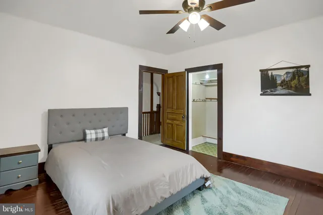 a bedroom with bed and window