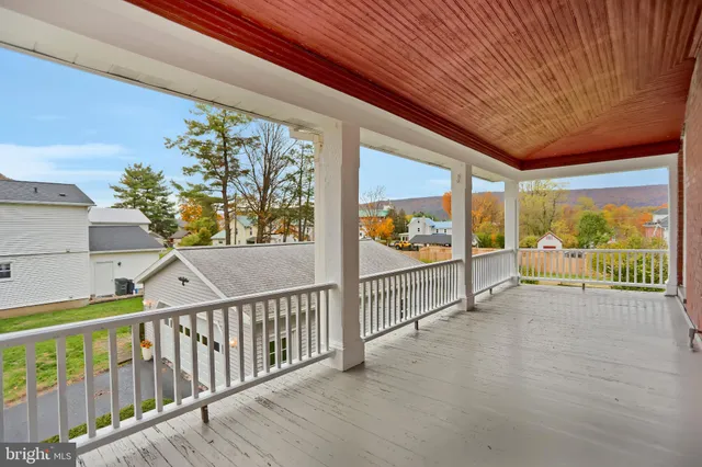 a view of house with backyard