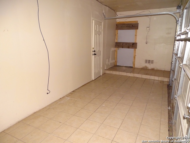 7338 Deep Spring Drive San Antonio, TX 78238 - Photo 14 of 33 a view of a room with rack on the wall