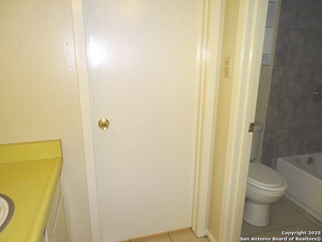 7338 Deep Spring Drive San Antonio, TX 78238 - Photo 19 of 33 a bathroom with a toilet and shower