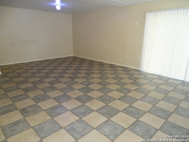 7338 Deep Spring Drive San Antonio, TX 78238 - Photo 4 of 33 an empty room with windows
