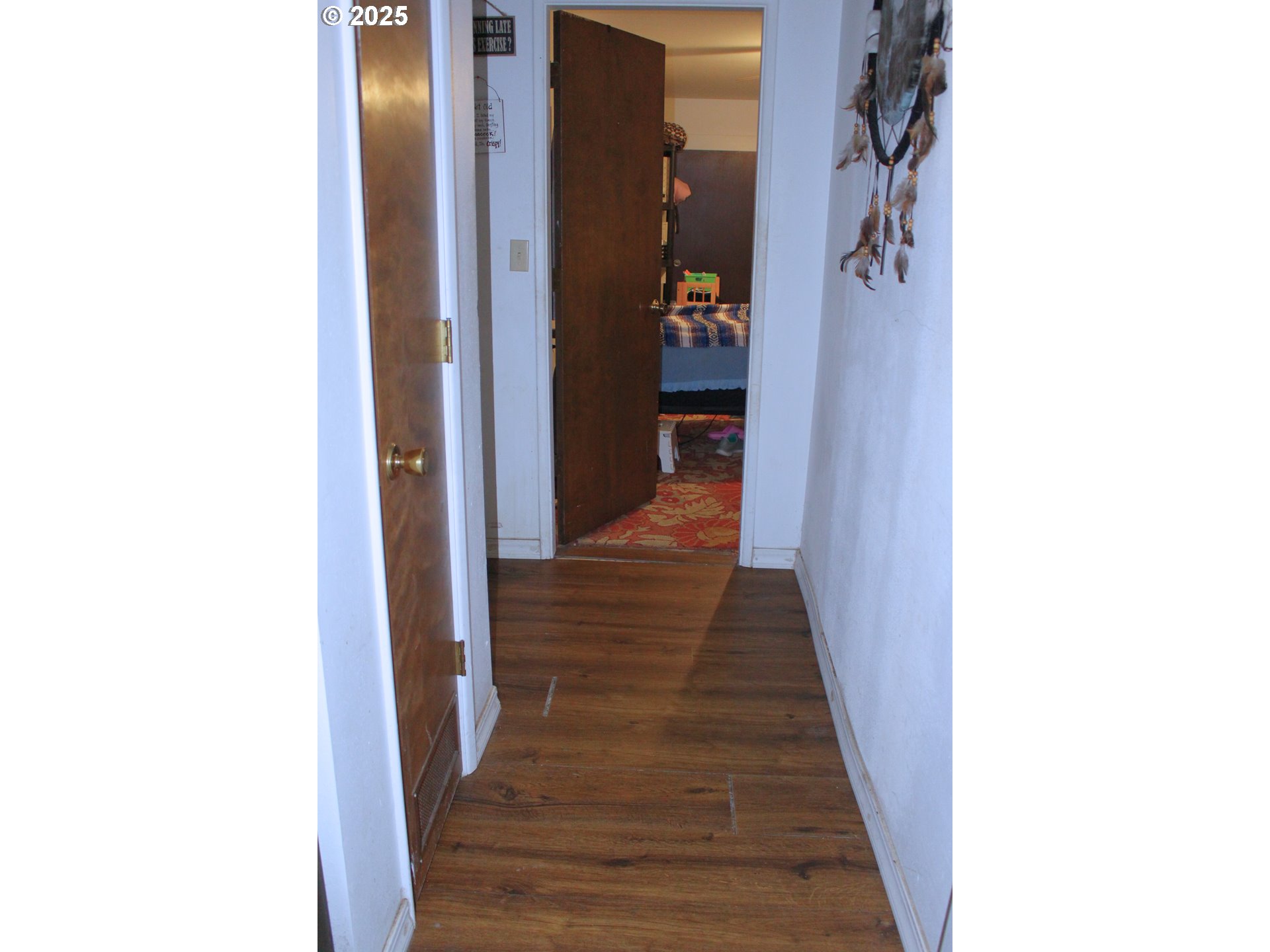89301 Shorecrest Drive Florence, OR 97439 - Photo 16 of 30 a view of a hallway with wooden floor