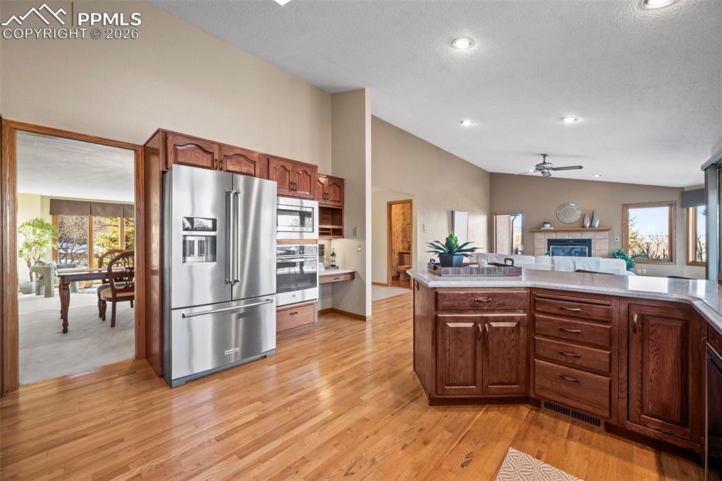 735 Pollux Drive Colorado Springs, CO 80906 - Photo 12 of 50 a kitchen with stainless steel appliances granite countertop a refrigerator and a sink