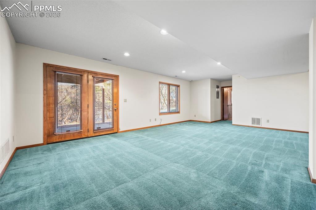 735 Pollux Drive Colorado Springs, CO 80906 - Photo 32 of 50 a view of an empty room with a window
