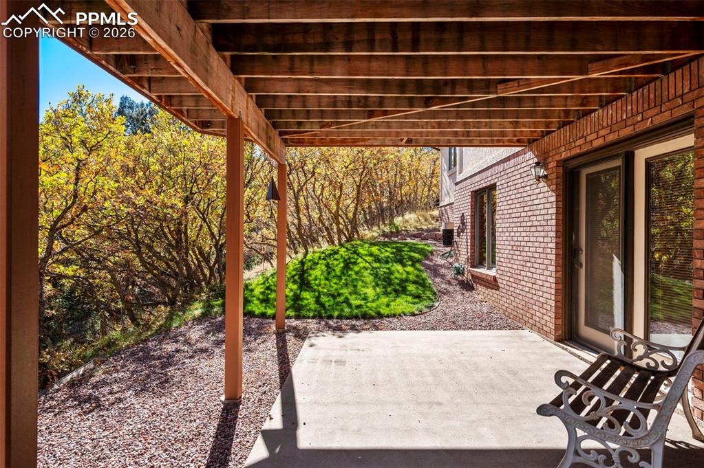 735 Pollux Drive Colorado Springs, CO 80906 - Photo 34 of 50 a view of a backyard with plants and outdoor seating