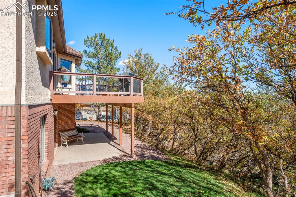 735 Pollux Drive Colorado Springs, CO 80906 - Photo 40 of 50 a view of a balcony with a tree