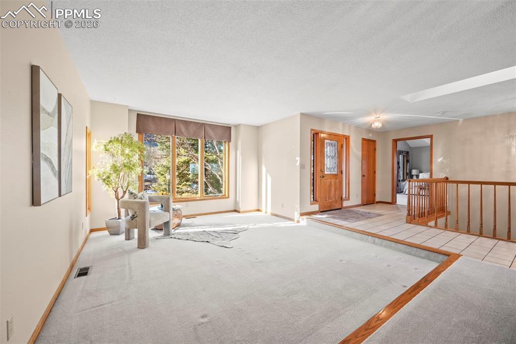 735 Pollux Drive Colorado Springs, CO 80906 - Photo 7 of 50 a spacious bedroom with a large bed and a large window
