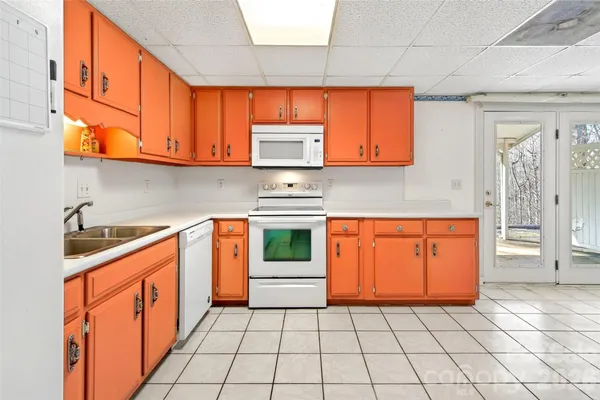 a kitchen with stainless steel appliances granite countertop a sink and cabinets