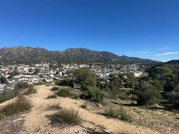a view of a city with mountains in the background