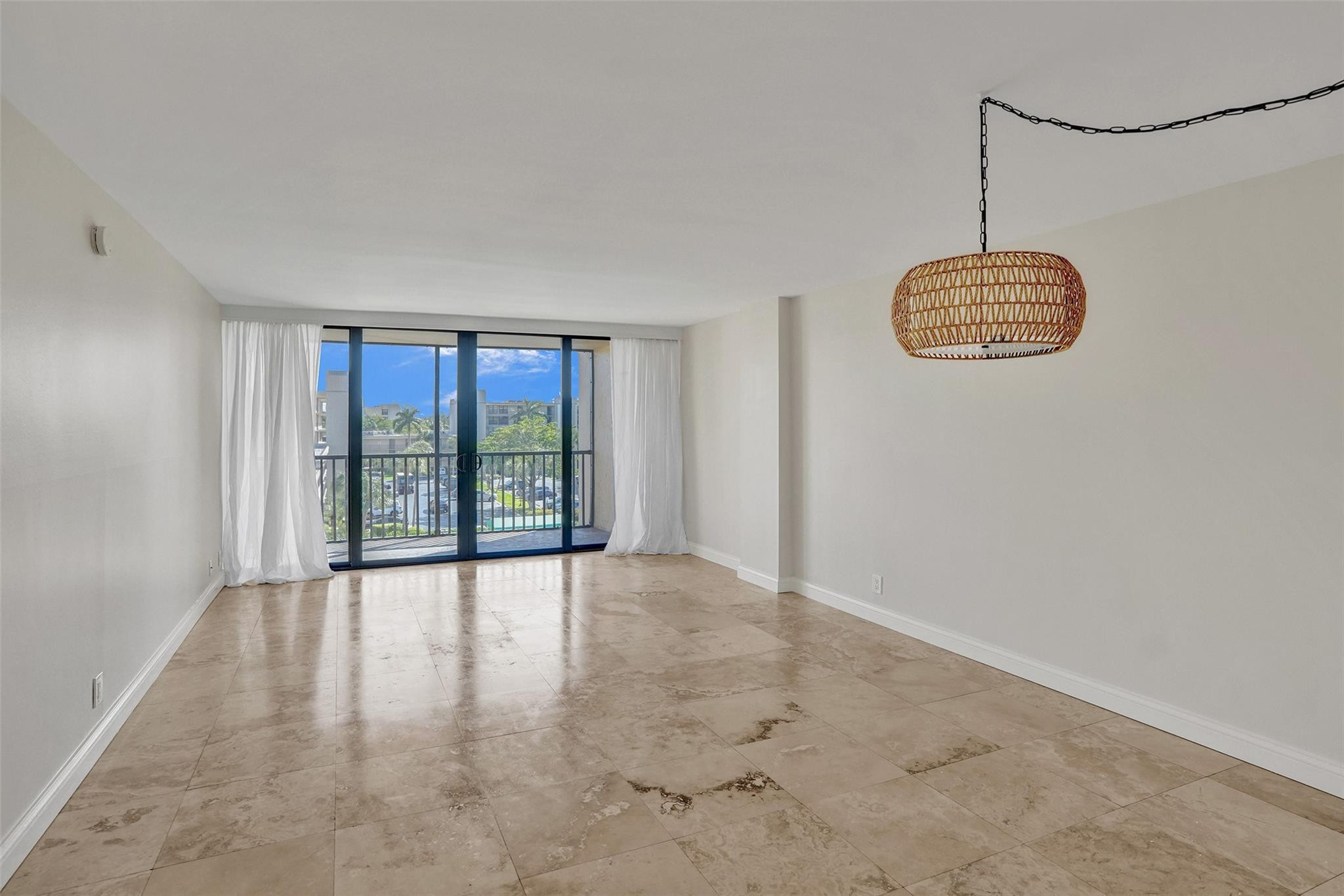 4 Royal Palm Way, Unit 503 Boca Raton, FL 33432 - Photo 11 of 36 a view of an empty room with glass door and balcony