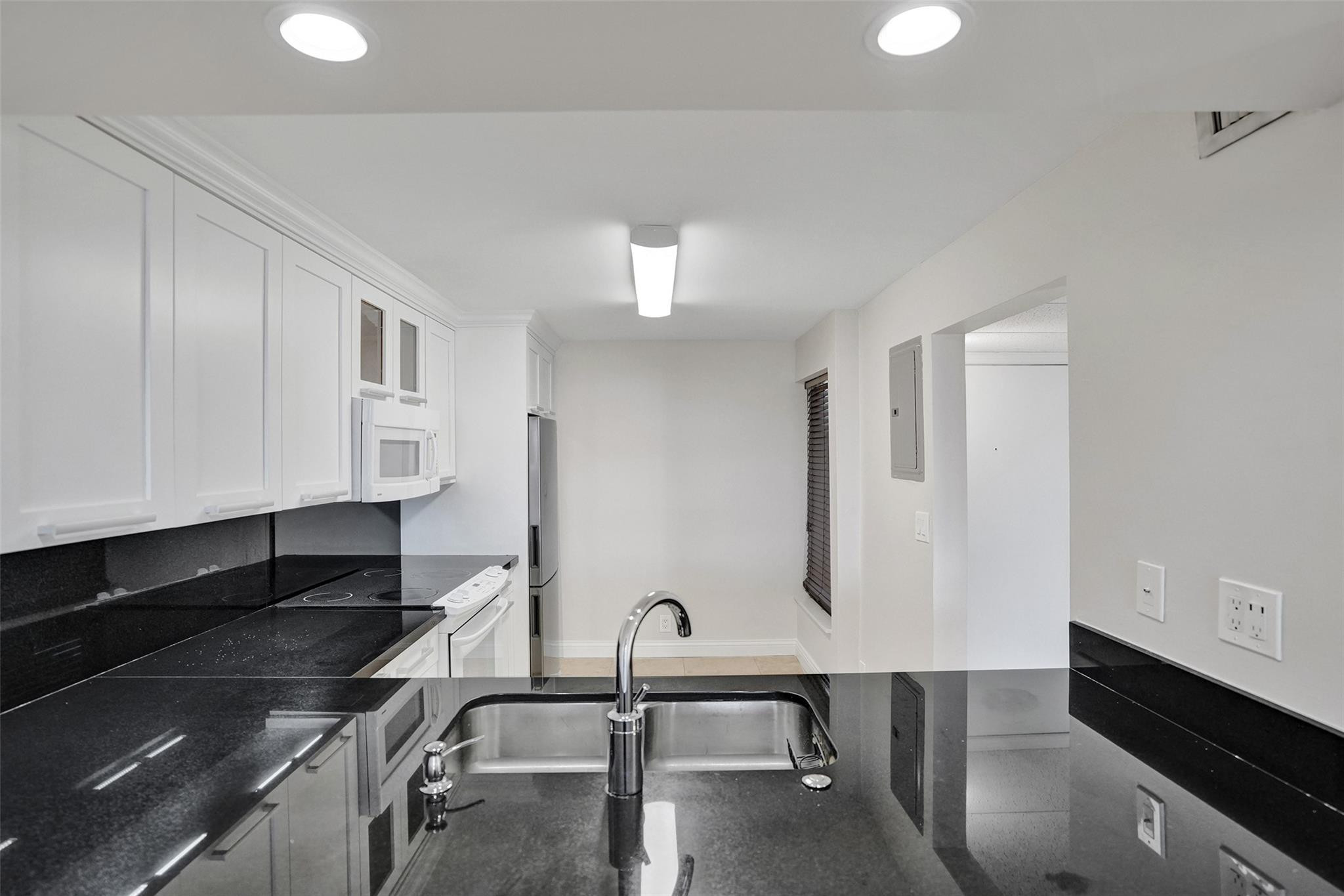 4 Royal Palm Way, Unit 503 Boca Raton, FL 33432 - Photo 12 of 36 a bathroom with a sink and a mirror
