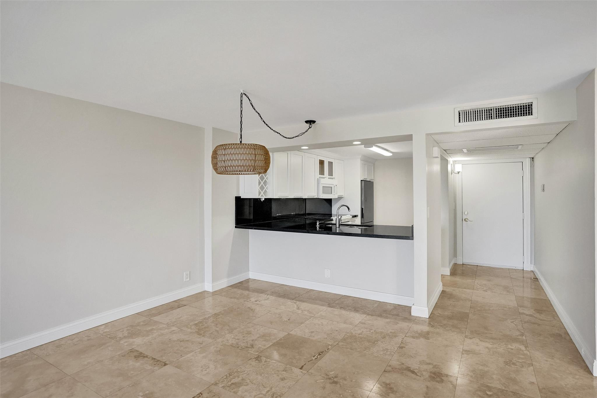 4 Royal Palm Way, Unit 503 Boca Raton, FL 33432 - Photo 18 of 36 a view of a kitchen with a sink and refrigerator