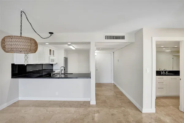 a view of a hallway with closet area