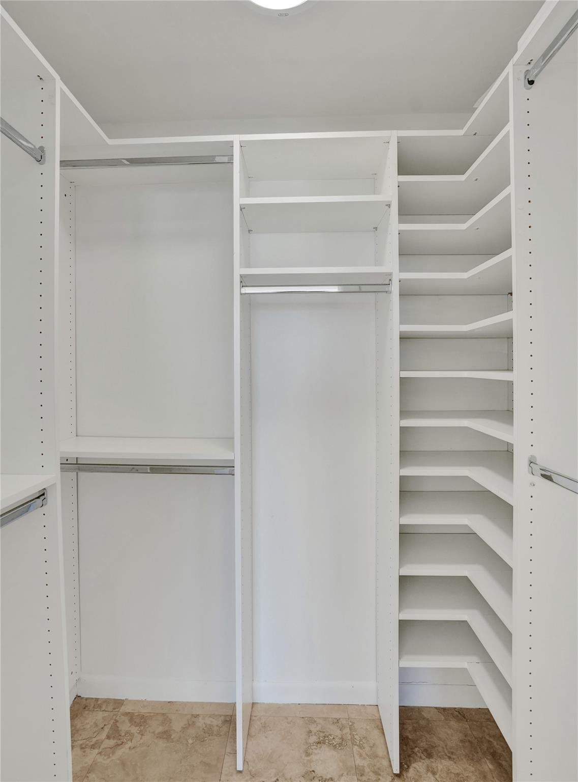 4 Royal Palm Way, Unit 503 Boca Raton, FL 33432 - Photo 24 of 36 a view of walk in closet with empty racks