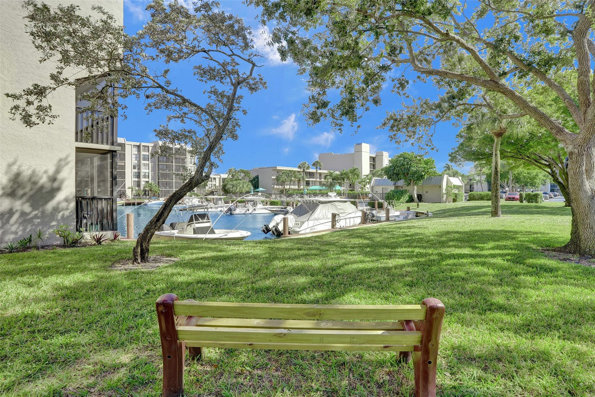 4 Royal Palm Way, Unit 503 Boca Raton, FL 33432 - Photo 33 of 36 a view of a big yard with potted plants and large trees